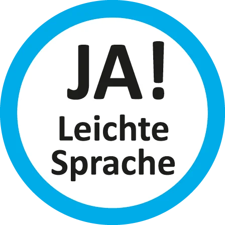In einem blauen Kreis steht „Ja! Leichte Sprache“.